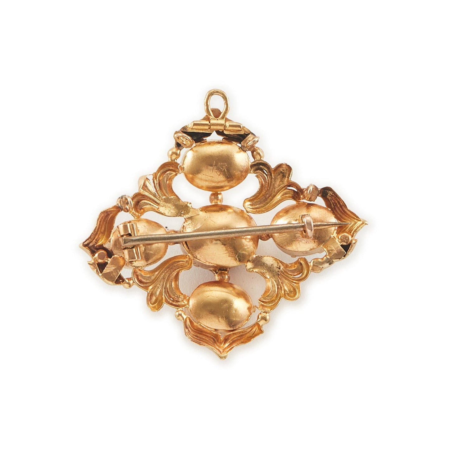 Beautiful Victorian repoussé brooch set with four cabochon Bohemian garnets. The piece can also be worn as a pendant.