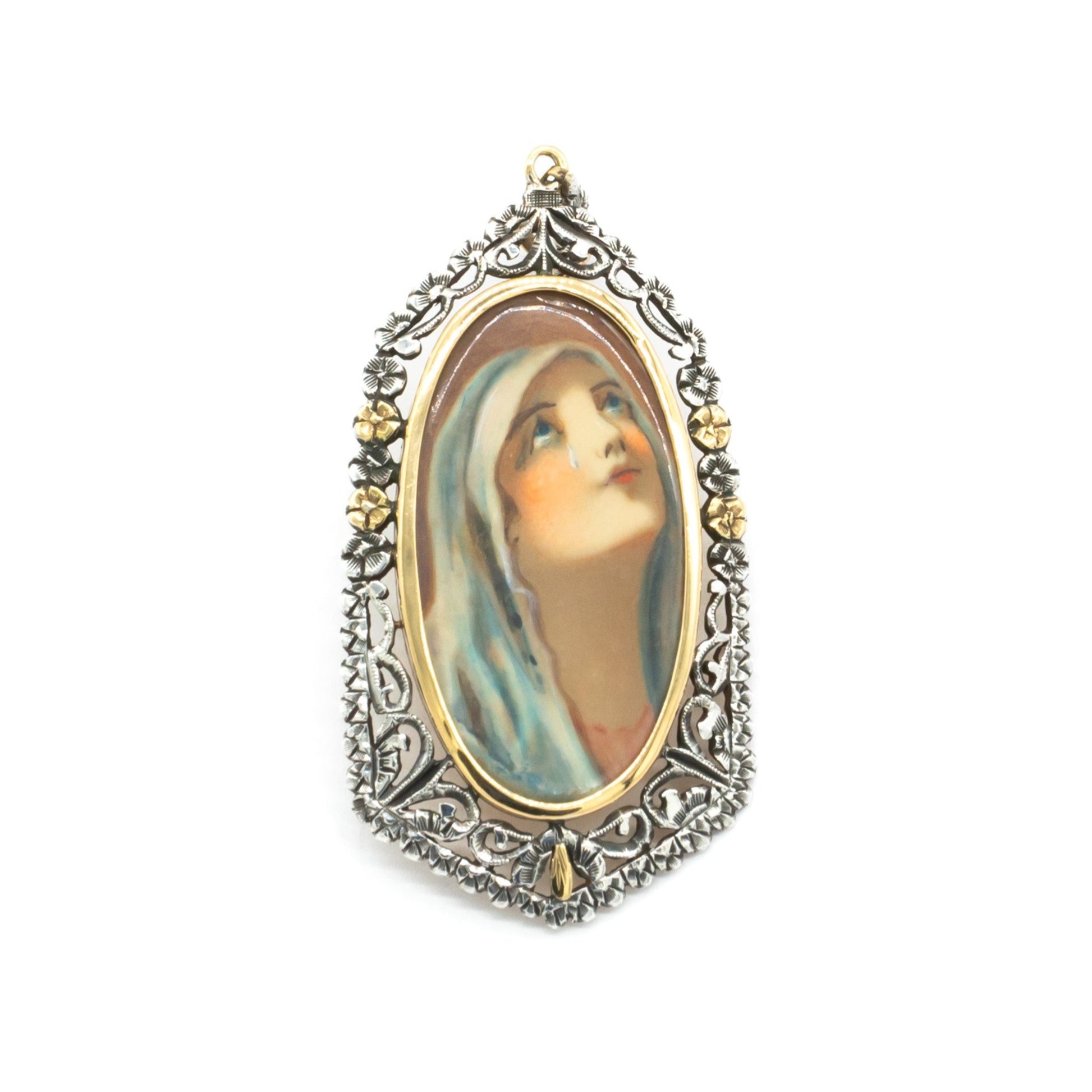 Beautifully hand-painted Victorian Madonna pendant set in an ornate, floral 18ct gold and silver frame.