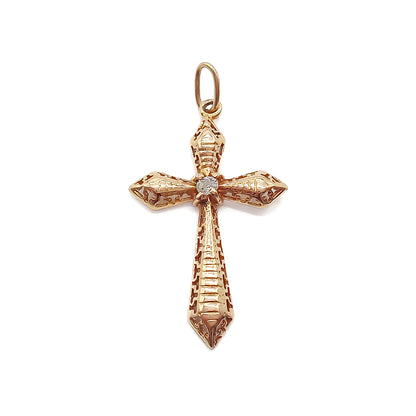 Delicate Victorian rose gold cross with intricate detail. Set with an old-cut diamond.