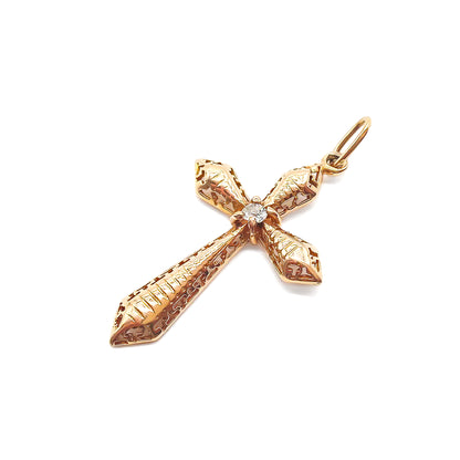 Delicate Victorian rose gold cross with intricate detail. Set with an old-cut diamond.