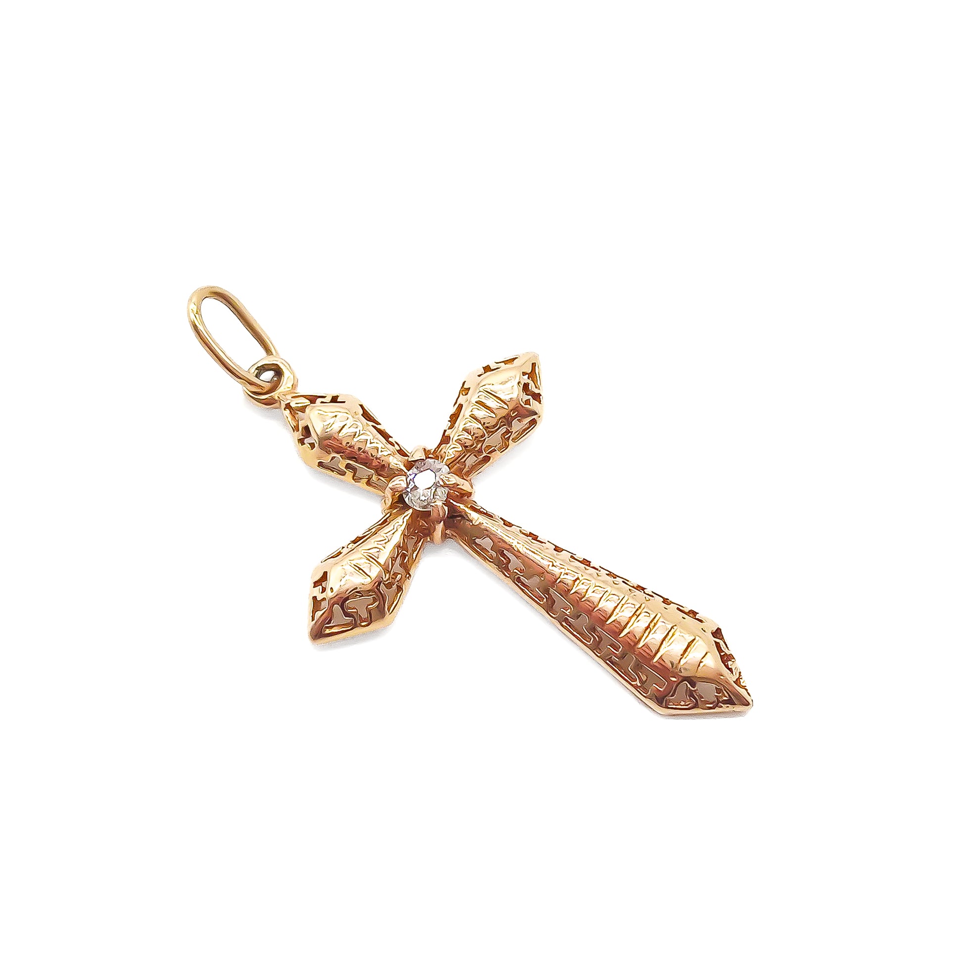 Delicate Victorian rose gold cross with intricate detail. Set with an old-cut diamond.