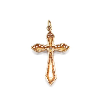 Delicate Victorian rose gold cross with intricate detail. Set with an old-cut diamond.