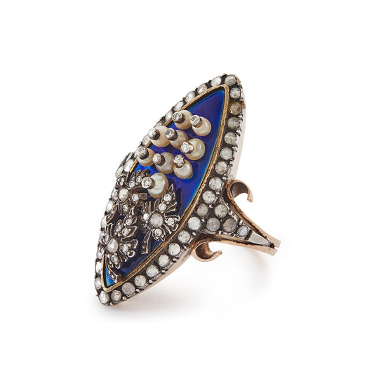 Magnificent and unusual Victorian marquise-shaped 18ct rose gold and silver blue enamel ring. The ring is accented with nine riveted pearls topped with diamonds and three riveted diamond-encrusted leaves. The piece also has rough-cut diamonds around the rim and shoulders. A real statement piece!