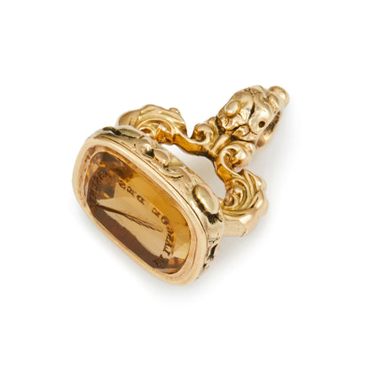 Very ornate Victorian 9ct gold fob seal with a citrine intaglio depicting a feather and Latin writing in an ornate setting. 