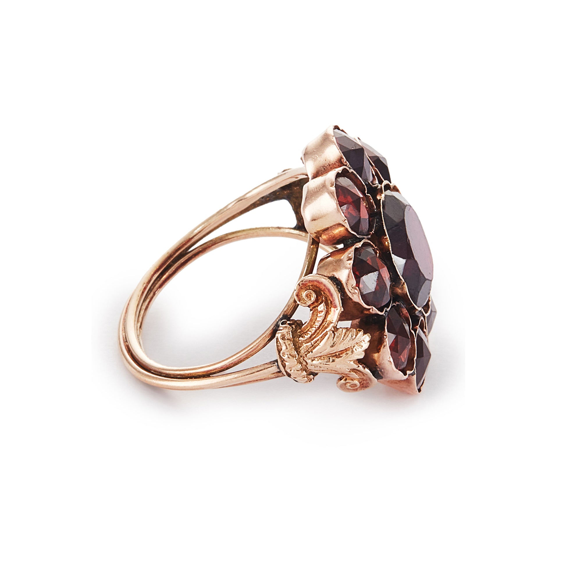 Spectacular Victorian 9ct gold cocktail ring with nine deep red Bohemian garnets in a cluster setting. The ring has lovely scrollwork detail on the shoulders.