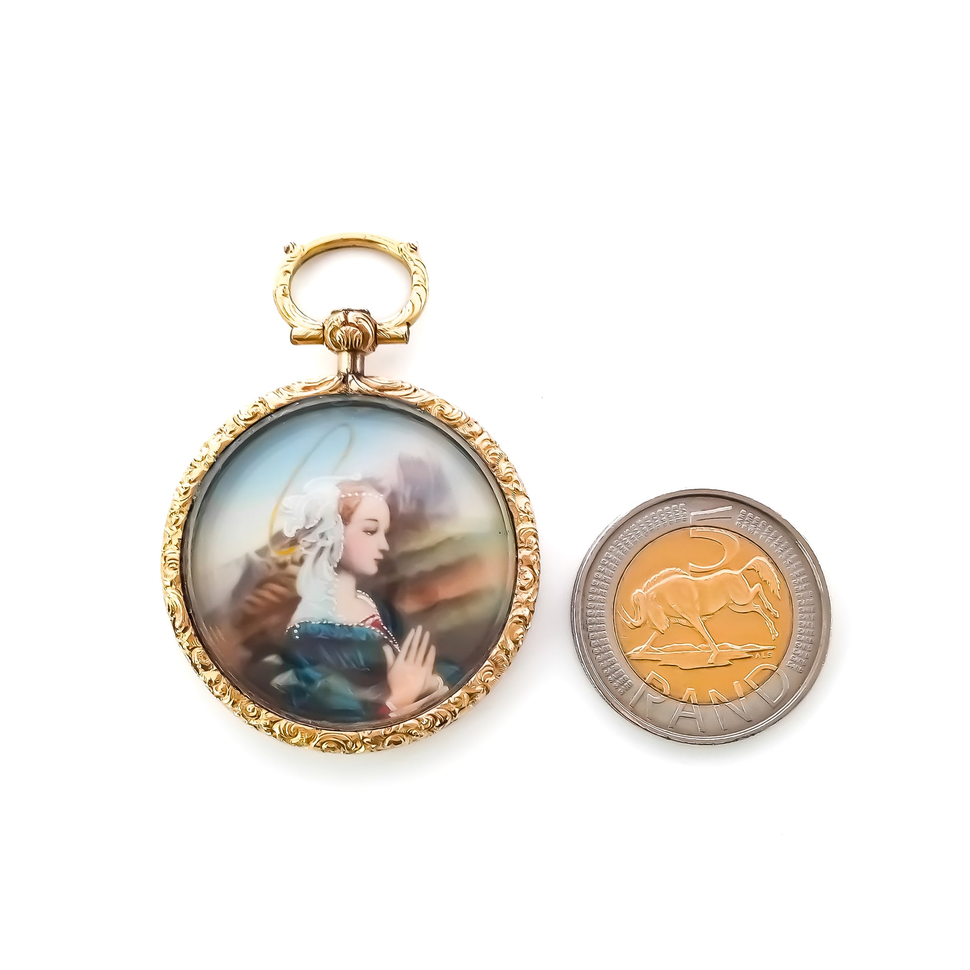 Pretty Victorian hand painted miniature under glass in a beautifully engraved 9ct gold setting.