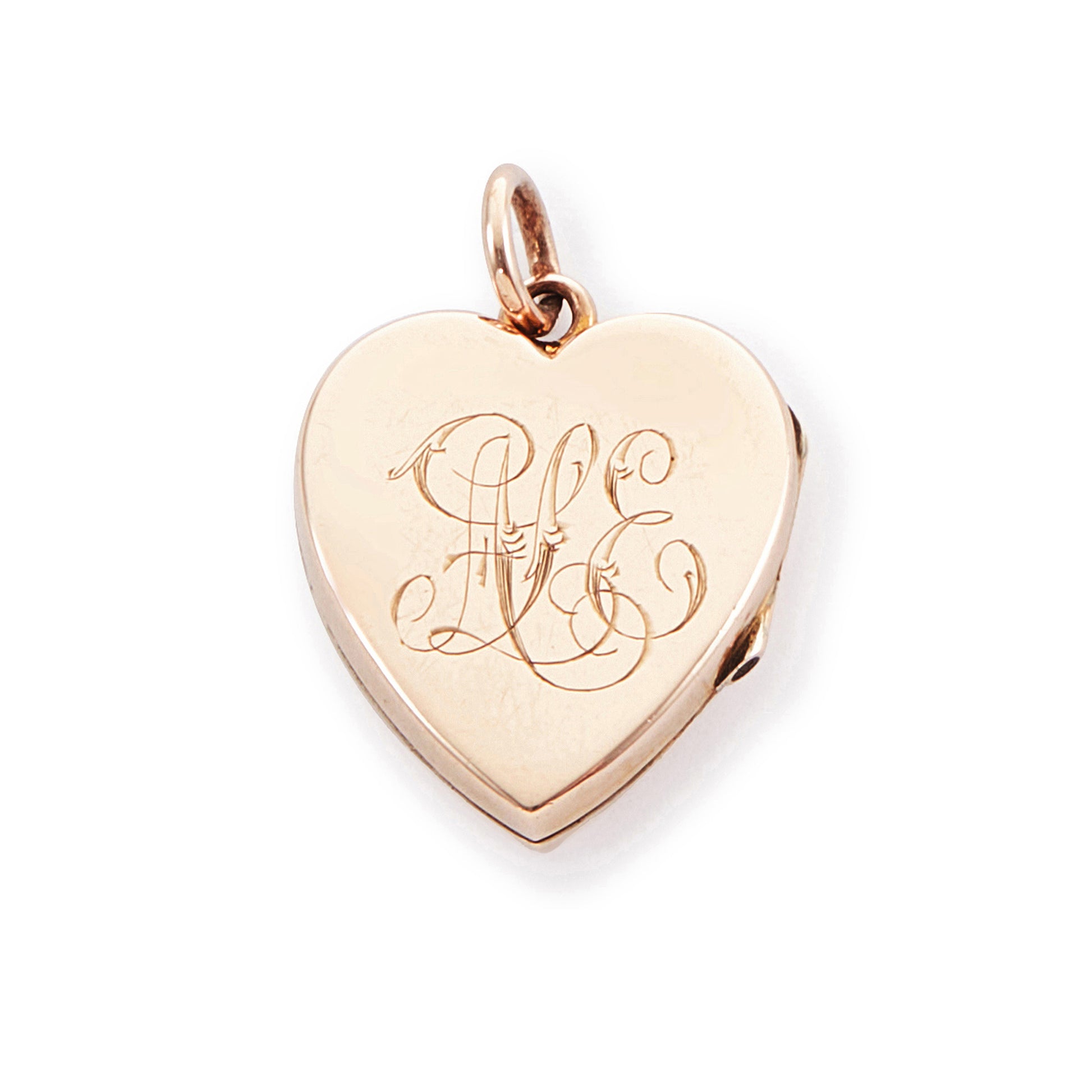 Pretty 9ct rose gold Victorian locket in the shape of a heart, adorned with a single seed pearl. The locket is inscribed with a fancy script monogram at the back. Can hold two photos inside.