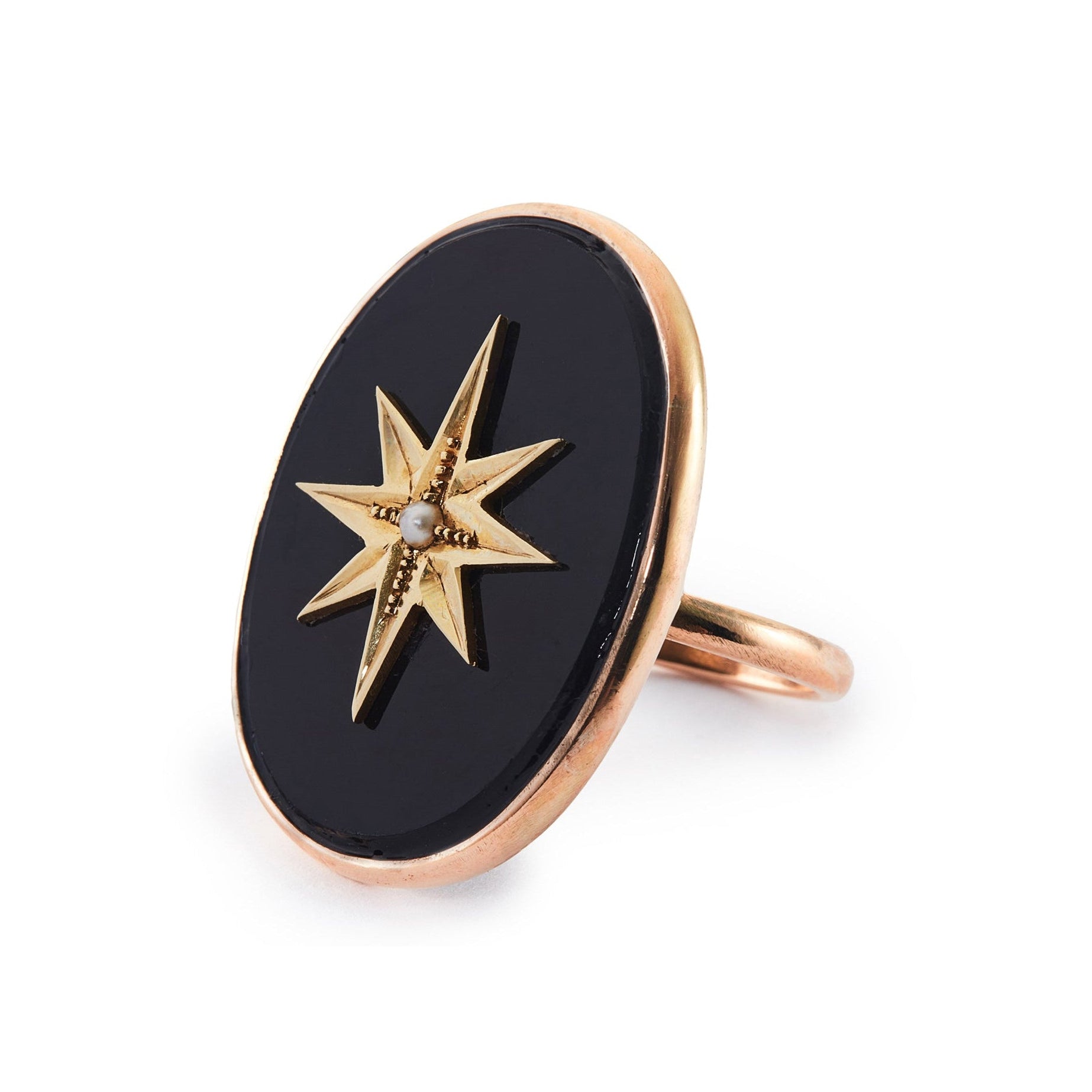 Magnificent 9ct rose gold ring set with a Victorian oval onyx disk, embellished with a 15ct yellow gold star and centre seed pearl. Later shank.