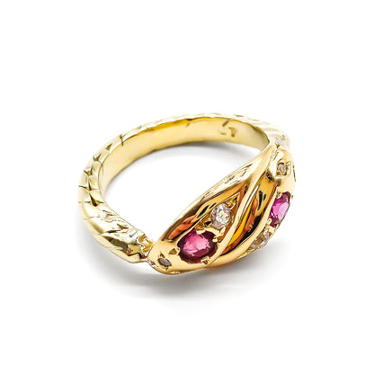 Stunning Victorian 9ct gold snake ring set with two rubies and six old-cut diamonds.