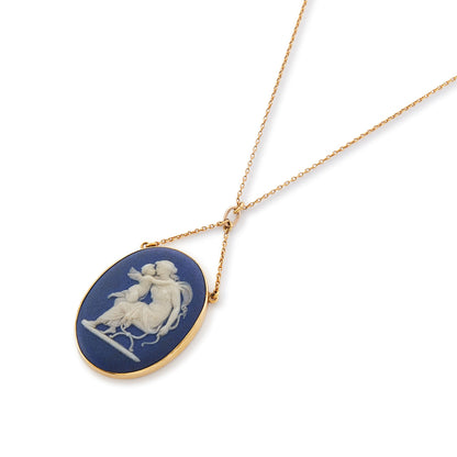 Pretty Victorian 9ct yellow gold pendant, tube-set with a beautiful blue Wedgwood cameo depicting Artemis/Diana embracing a cherub, on a dainty 9ct gold chain.
