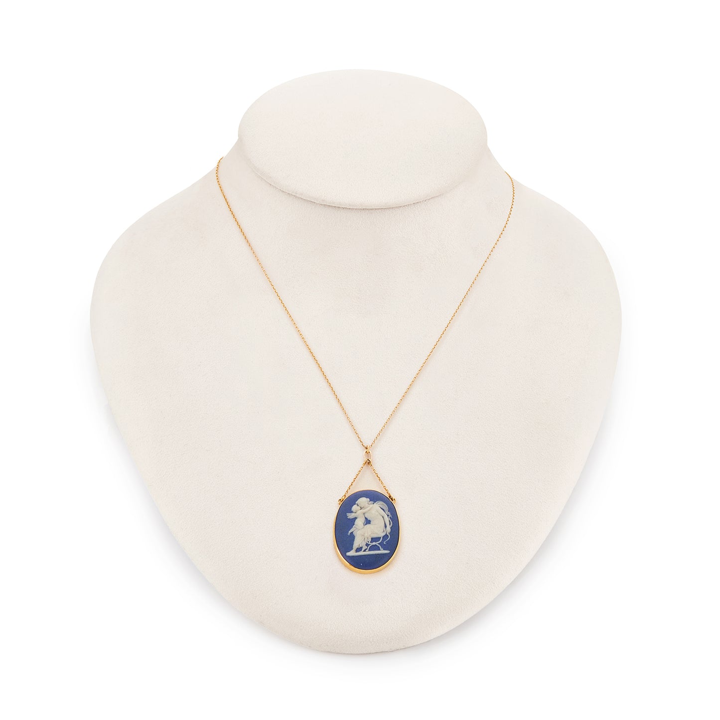 Pretty Victorian 9ct yellow gold pendant, tube-set with a beautiful blue Wedgwood cameo depicting Artemis/Diana embracing a cherub, on a dainty 9ct gold chain.