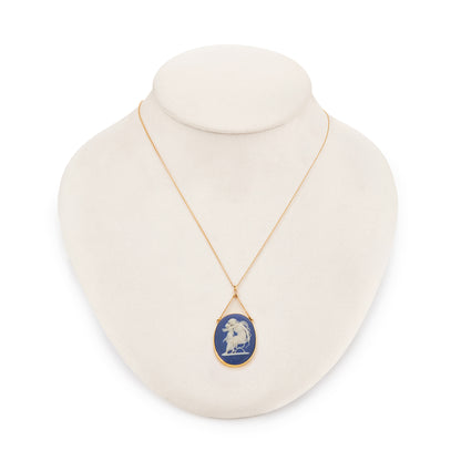 Pretty Victorian 9ct yellow gold pendant, tube-set with a beautiful blue Wedgwood cameo depicting Artemis/Diana embracing a cherub, on a dainty 9ct gold chain.