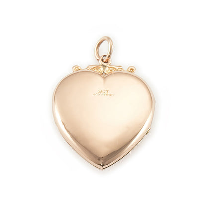 Lovely Victorian rose gold back and front puffy heart locket with a small mine-cut diamond in a star setting. Locket can take two photographs.