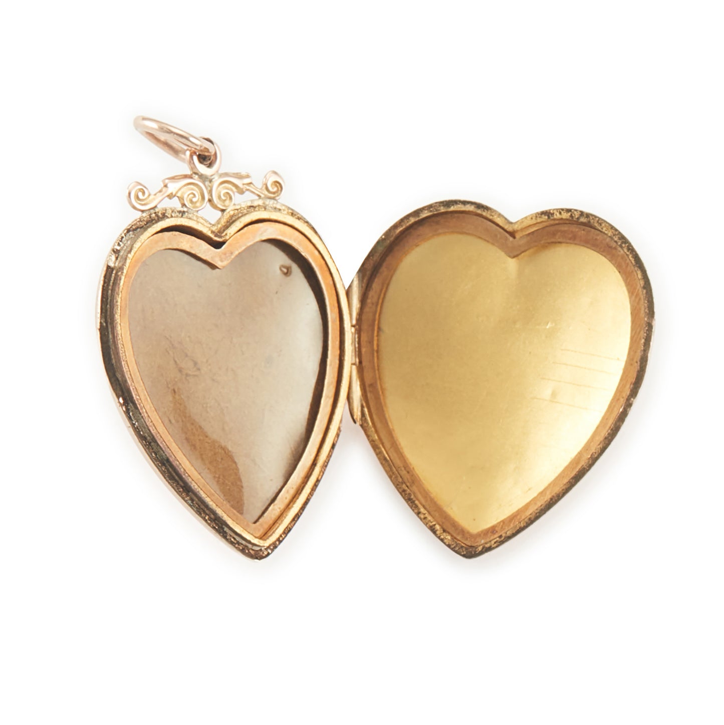 Lovely Victorian rose gold back and front puffy heart locket with a small mine-cut diamond in a star setting. Locket can take two photographs.