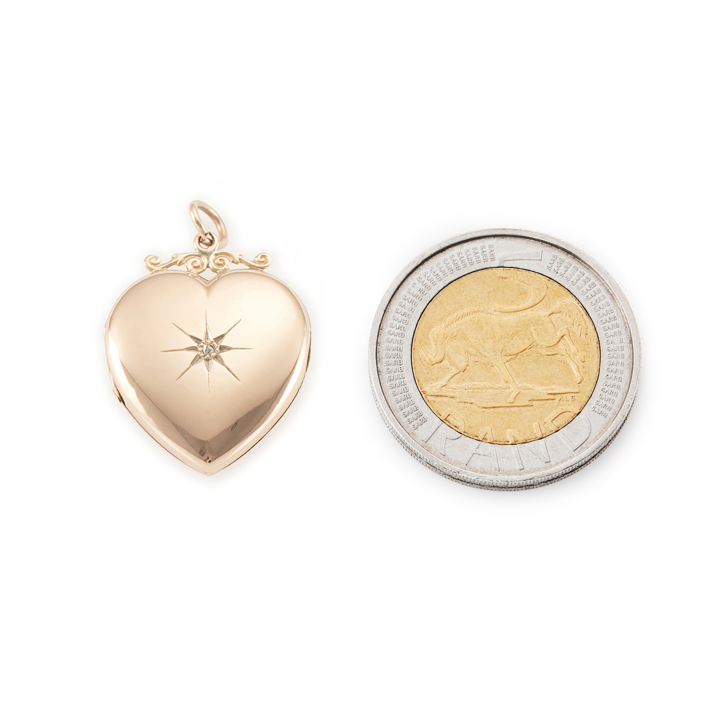 Lovely Victorian rose gold back and front puffy heart locket with a small mine-cut diamond in a star setting. Locket can take two photographs.