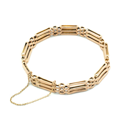 Classic Victorian 9ct rose gold gateleg bracelet with a safety chain.