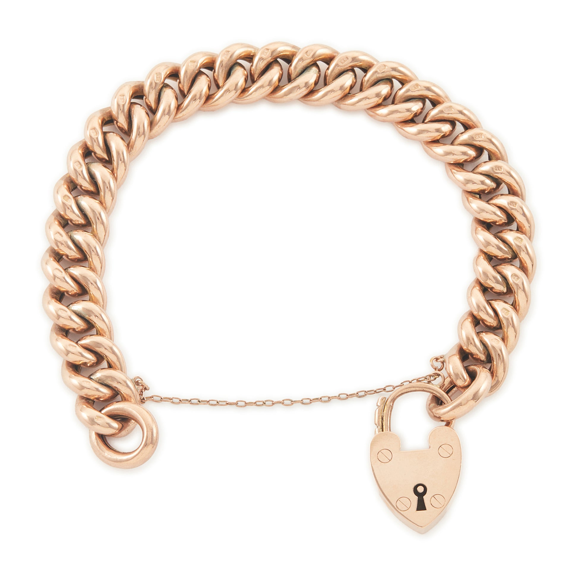 Classic Victorian 9ct rose gold curb link bracelet with a padlock and safety chain. The bracelet is plain on one side and with ornate engraving on the reverse side.