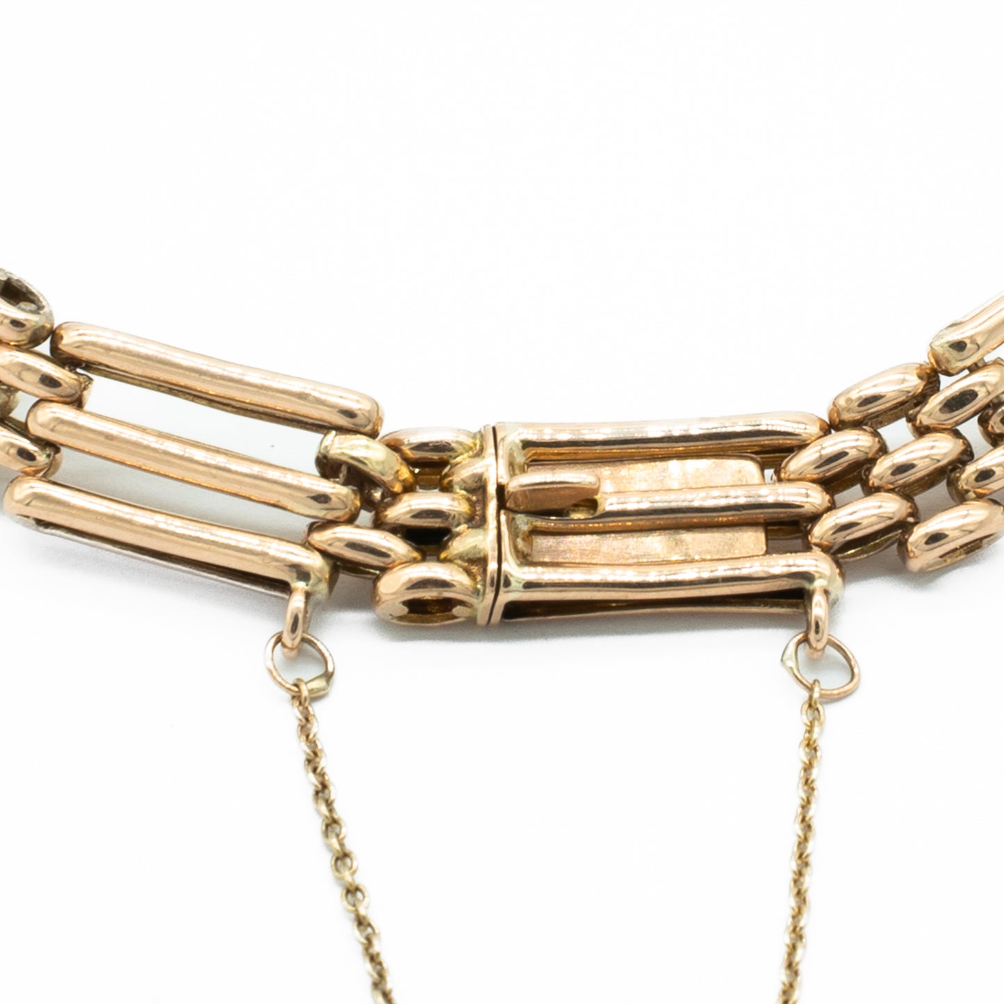 Classic Victorian 9ct rose gold gateleg bracelet with a safety chain.
