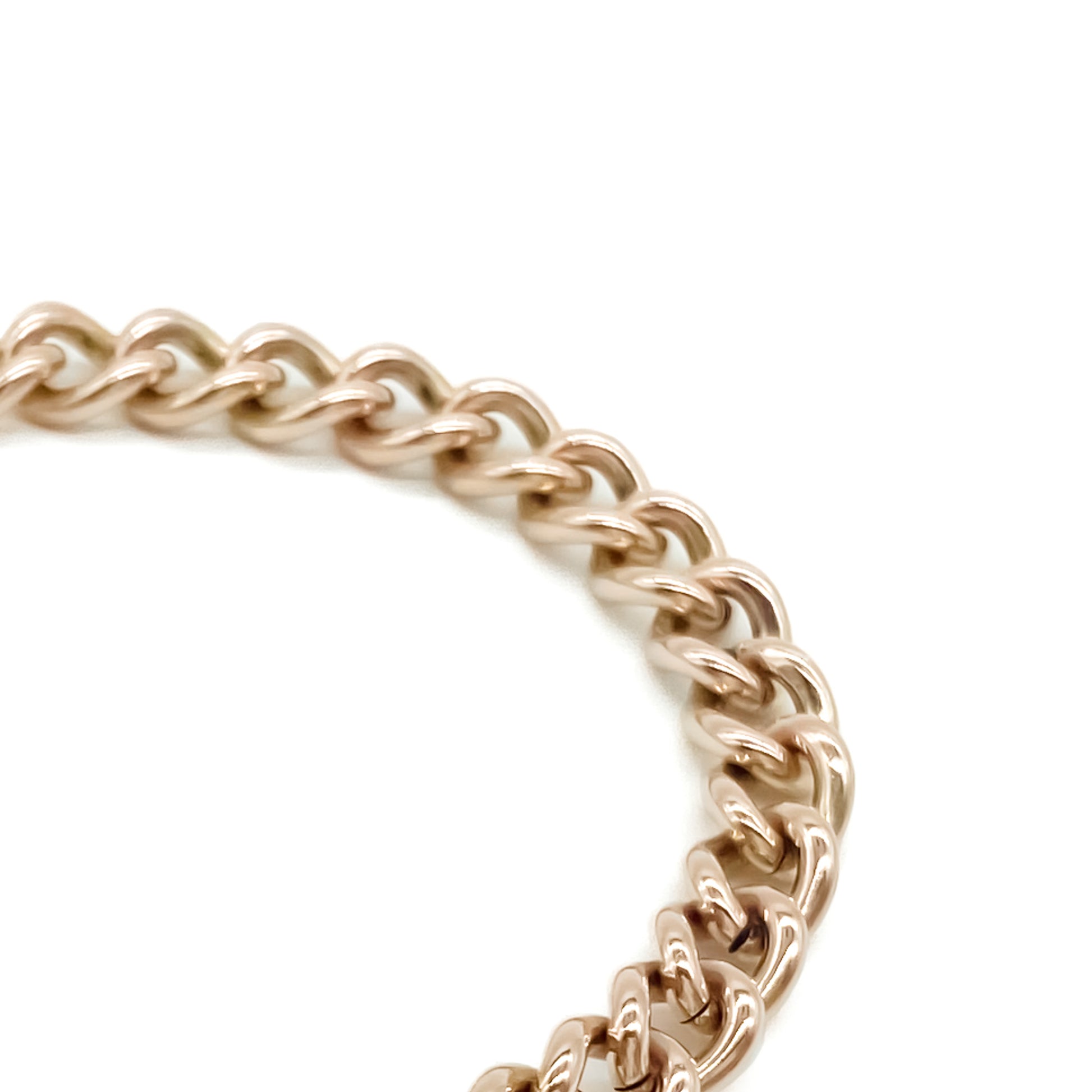 Classic Victorian 9ct solid rose gold curb link bracelet with a padlock and safety chain.