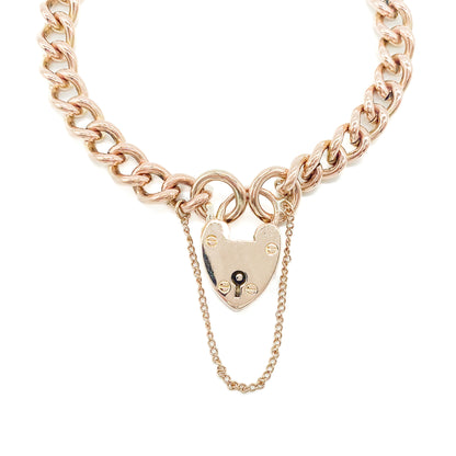 Classic Victorian 9ct solid rose gold curb link bracelet with a padlock and safety chain.