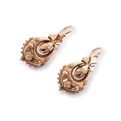 Exquisite 9ct rose gold Victorian dangling drop earrings with intricate repoussé details.