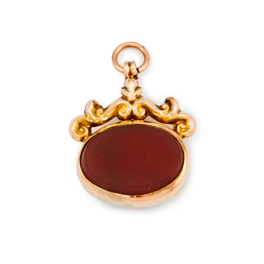 Quaint miniature Victorian 9ct rose gold fob with repoussé design, set with a bloodstone on one side and a carnelian on the other side.