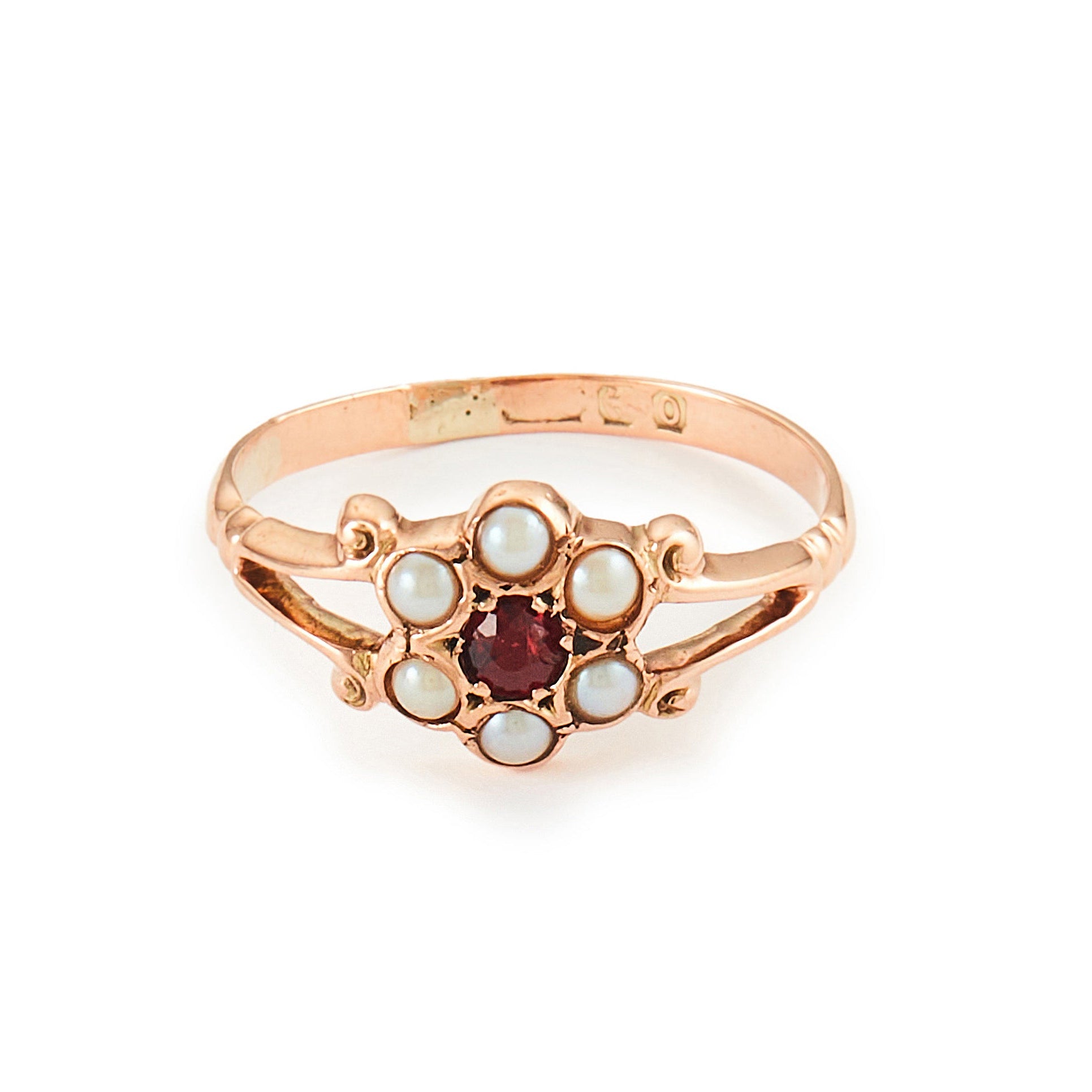 Dainty Victorian 9ct rose gold ring with six seed pearls and a centre garnet in a flower setting.