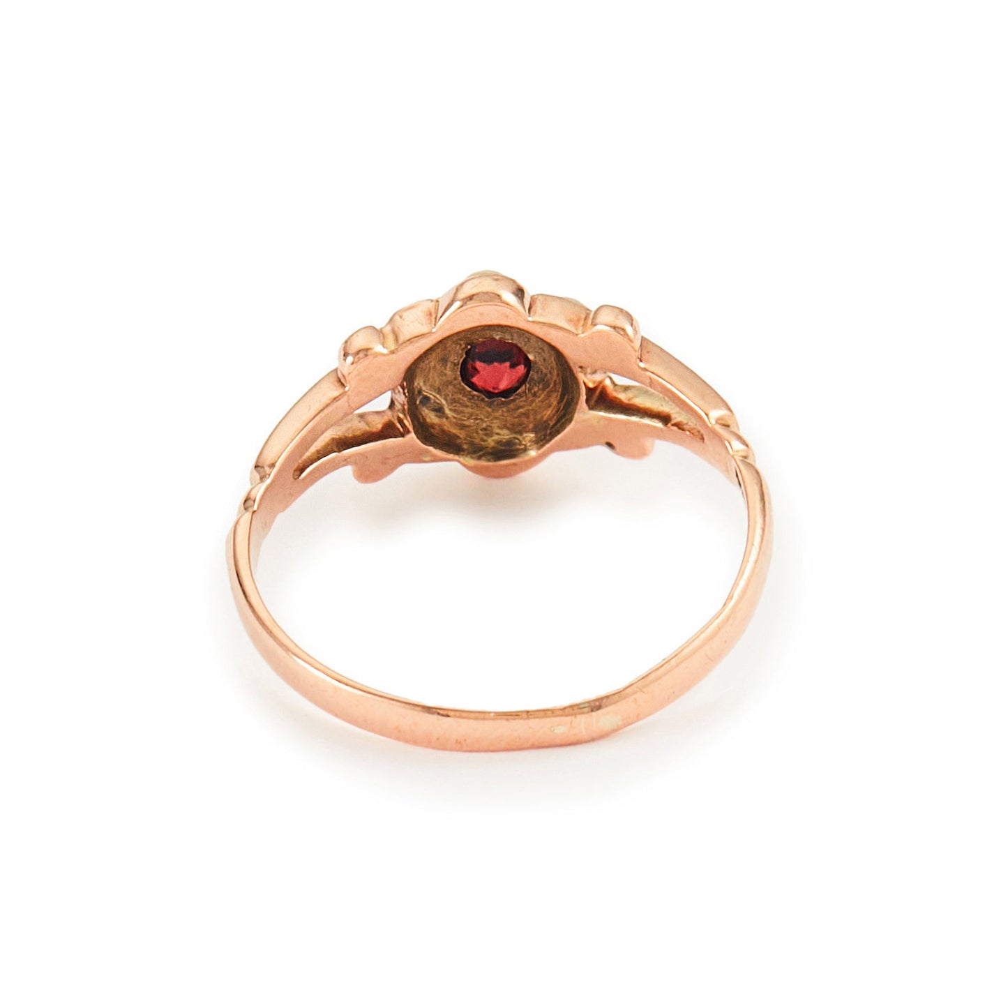 Dainty Victorian 9ct rose gold ring with six seed pearls and a centre garnet in a flower setting.