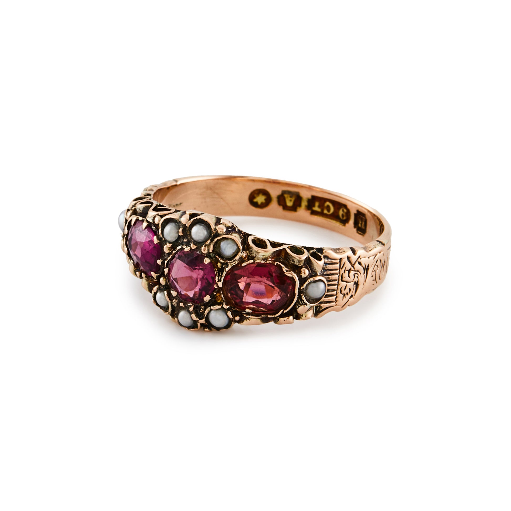 Pretty Victorian 9ct rose gold ring, set with three purple-pink garnets and eight small seed pearls. Beautiful engraving on shank.