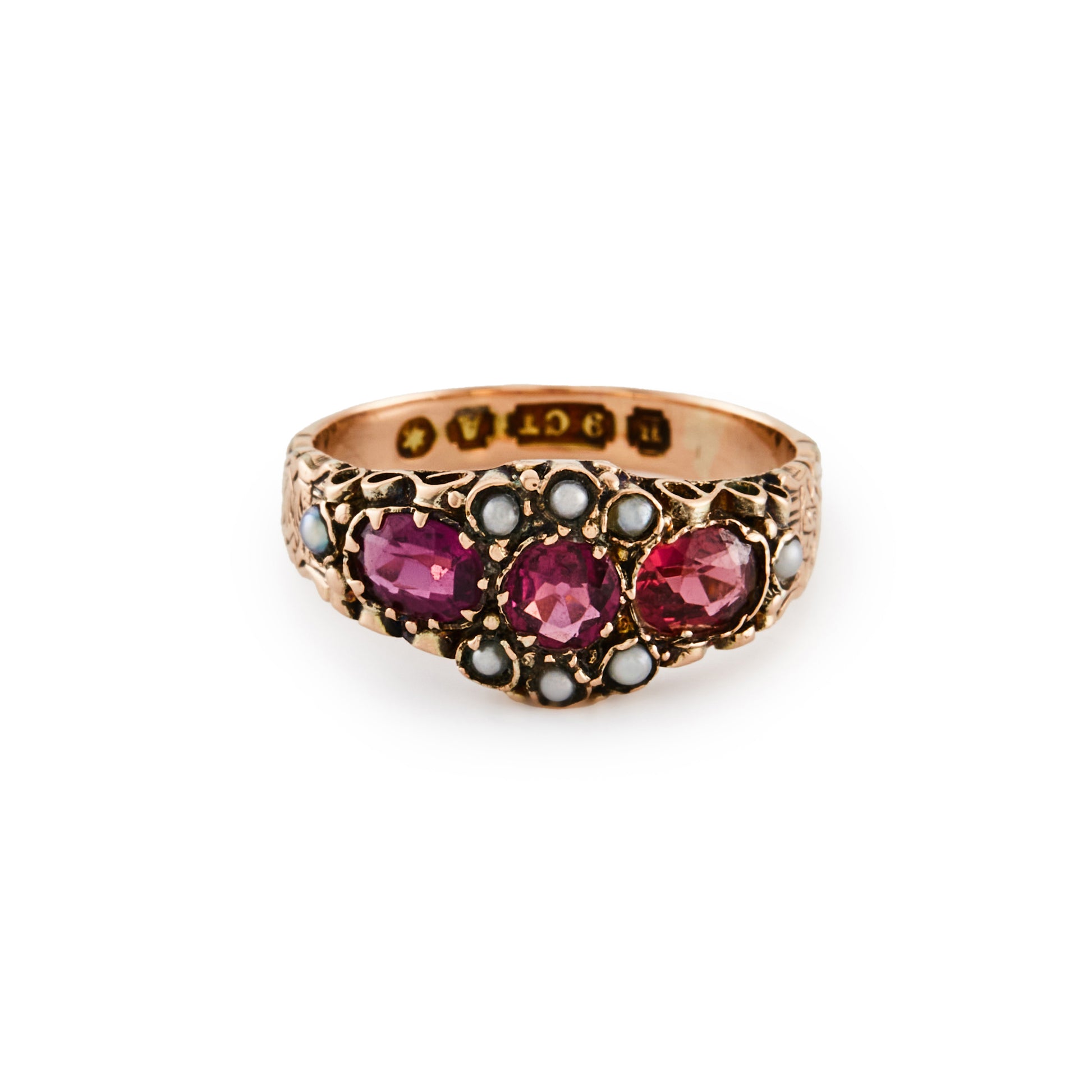 Pretty Victorian 9ct rose gold ring, set with three purple-pink garnets and eight small seed pearls. Beautiful engraving on shank.