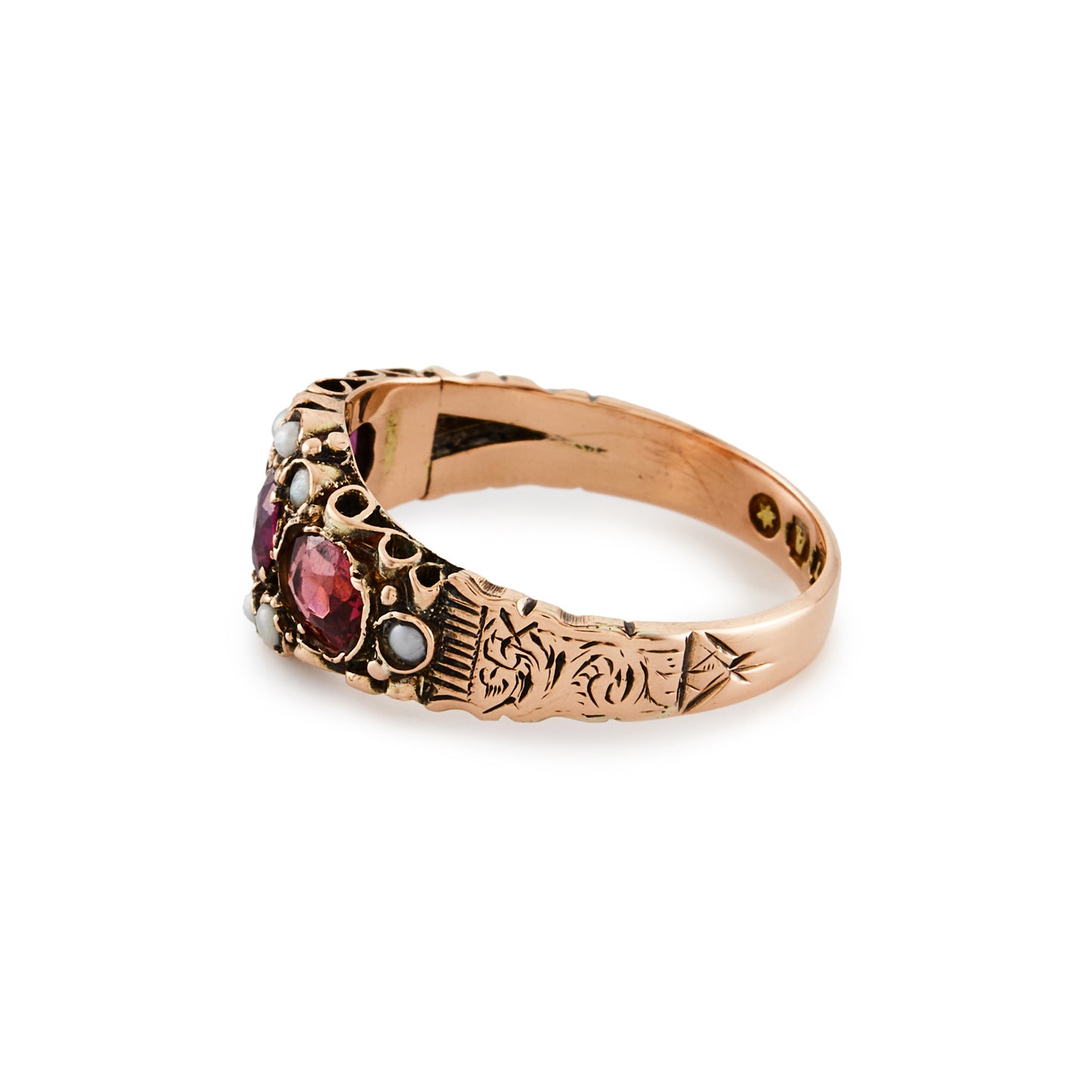 Pretty Victorian 9ct rose gold ring, set with three purple-pink garnets and eight small seed pearls. Beautiful engraving on shank.