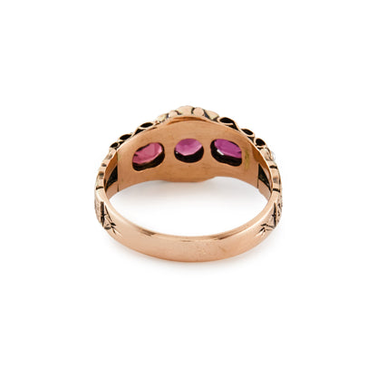 Pretty Victorian 9ct rose gold ring, set with three purple-pink garnets and eight small seed pearls. Beautiful engraving on shank.