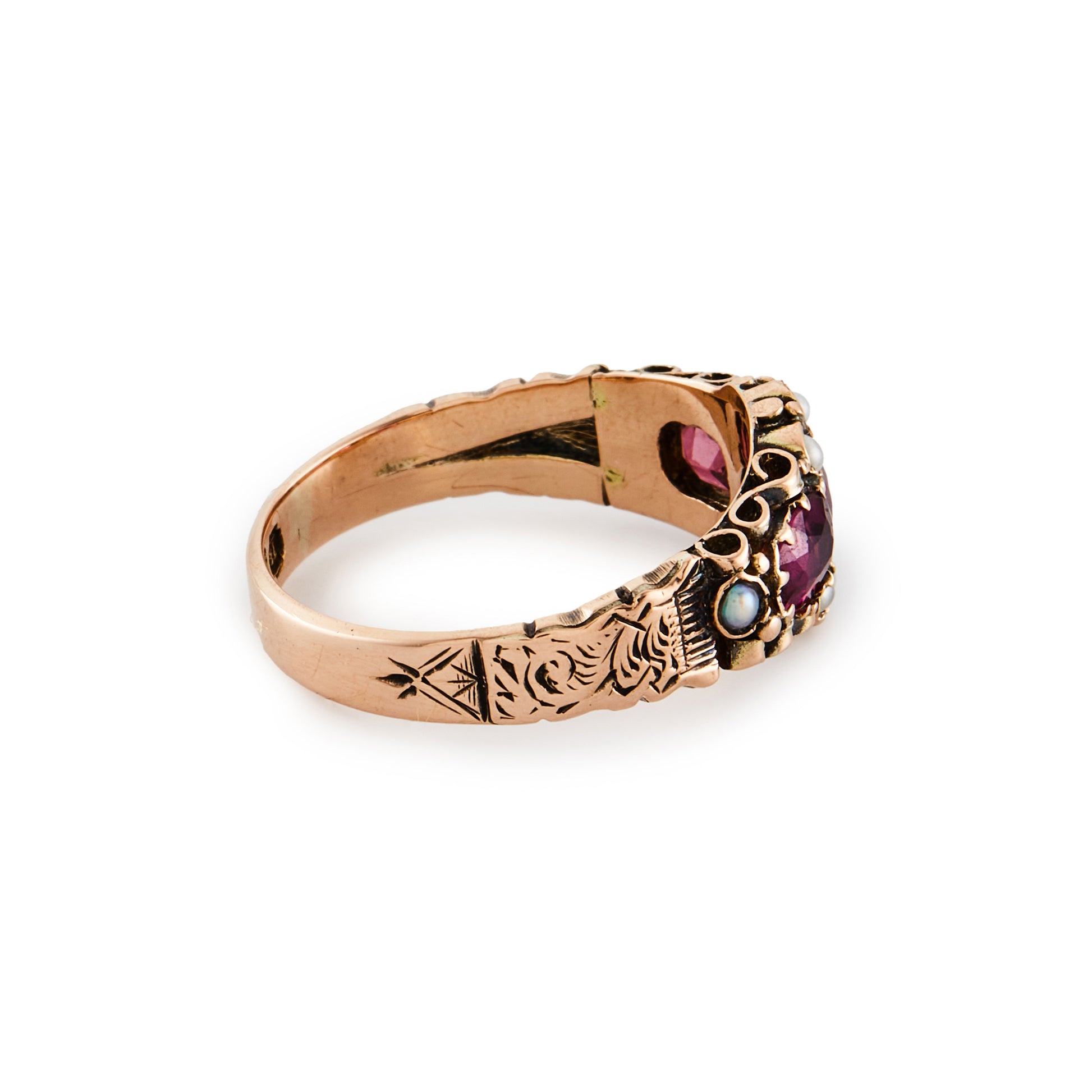 Pretty Victorian 9ct rose gold ring, set with three purple-pink garnets and eight small seed pearls. Beautiful engraving on shank.