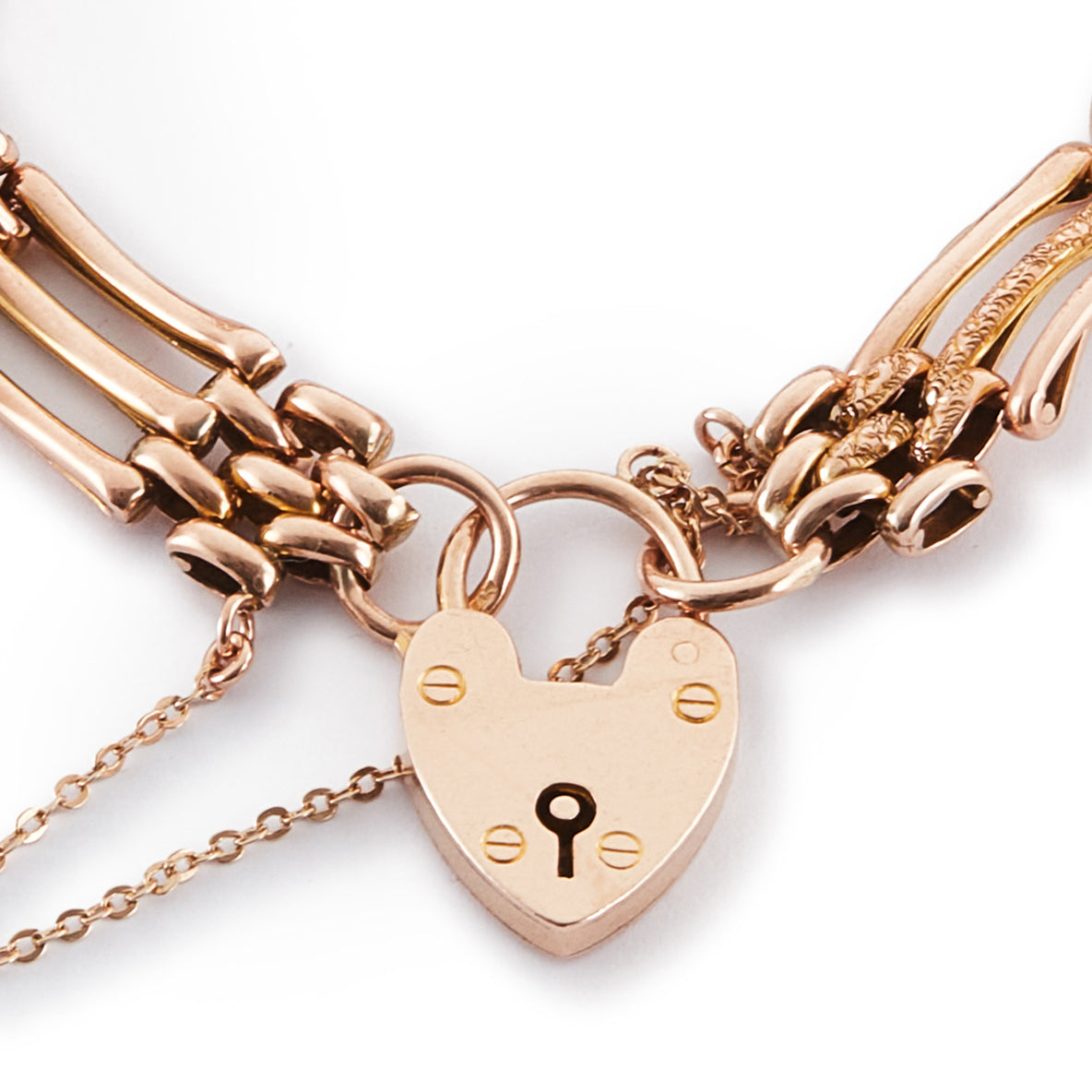 Stylish Victorian 9ct rose gold gateleg bracelet with a padlock and safety chain. Fine engraving on one side.
