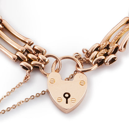 Stylish Victorian 9ct rose gold gateleg bracelet with a padlock and safety chain. Fine engraving on one side.