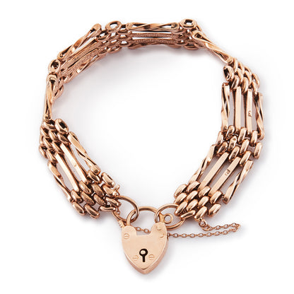 Stylish Victorian 9ct rose gold gateleg bracelet with some lightly textured links and a padlock. Safety chain attached.