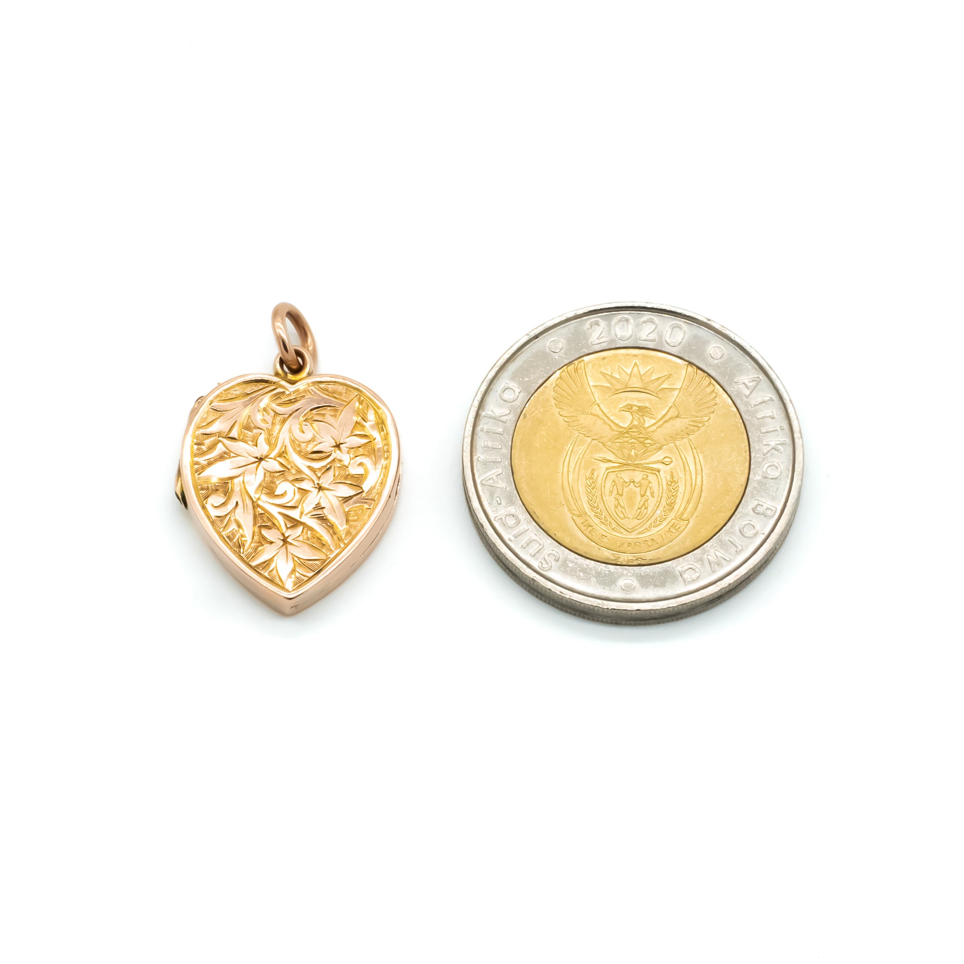 Beautifully engraved Victorian heart-shaped rose gold locket with lovely floral engraving on both sides.