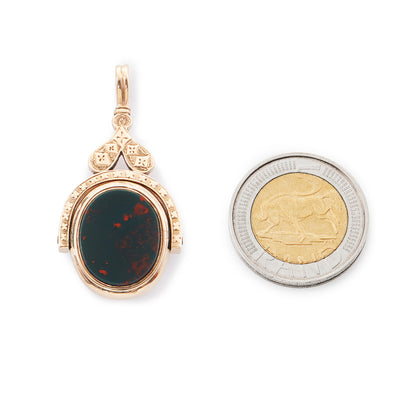 Exquisite Victorian 9ct rose gold swivel fob set with a carnelian on one side and a bloodstone on the reverse side. Beautifully engraved.