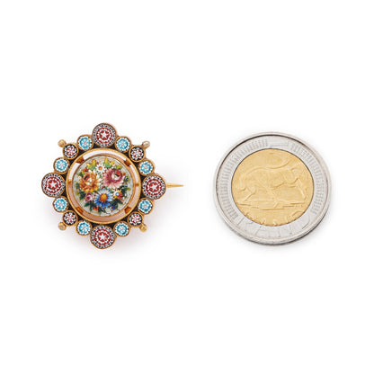 Beautifully detailed Victorian gilt Italian micro mosaic brooch depicting a colourful floral bouquet, surrounded by intricate stars.