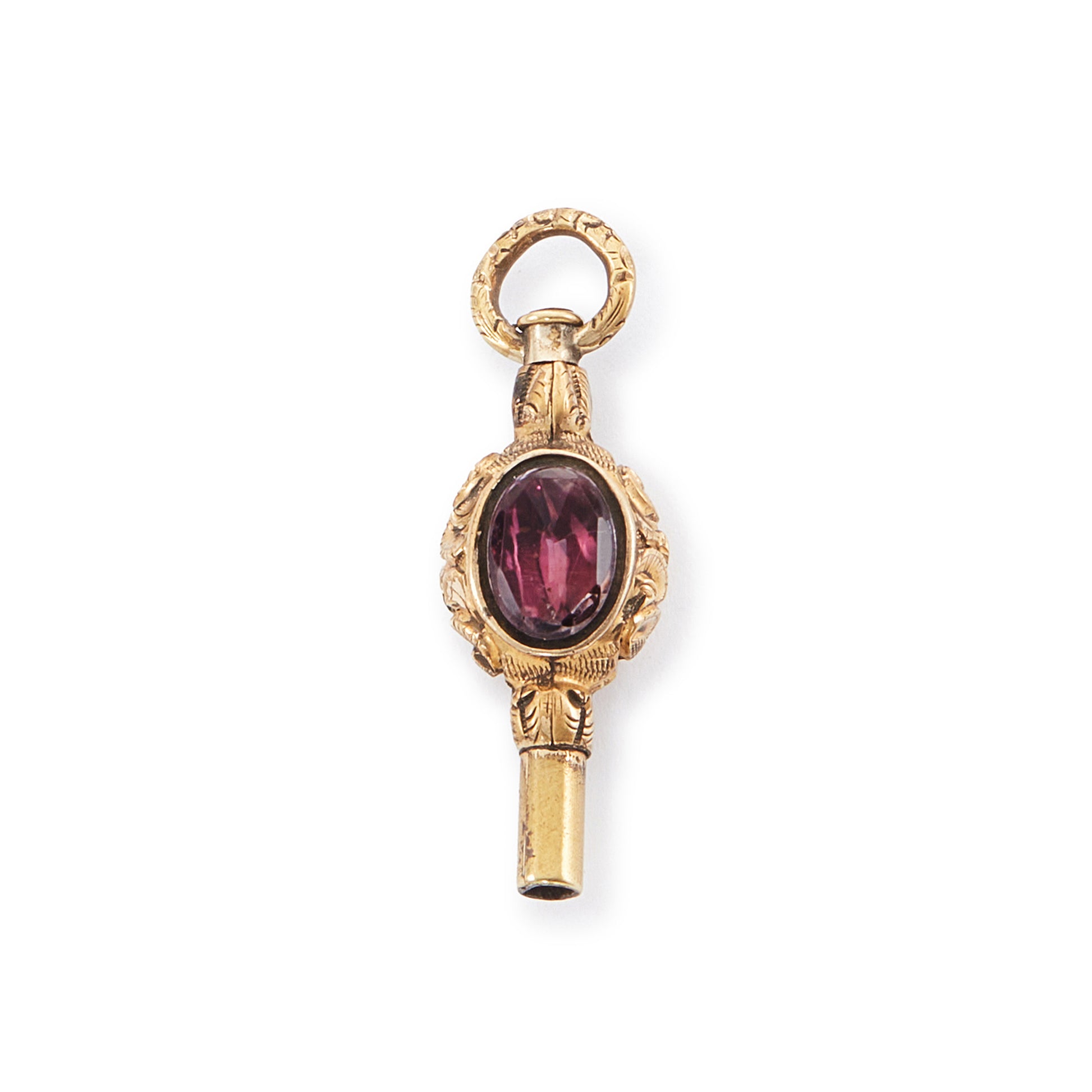 Quaint miniature Victorian gold-plated watch key set with an amethyst on one side and white agate on the other.