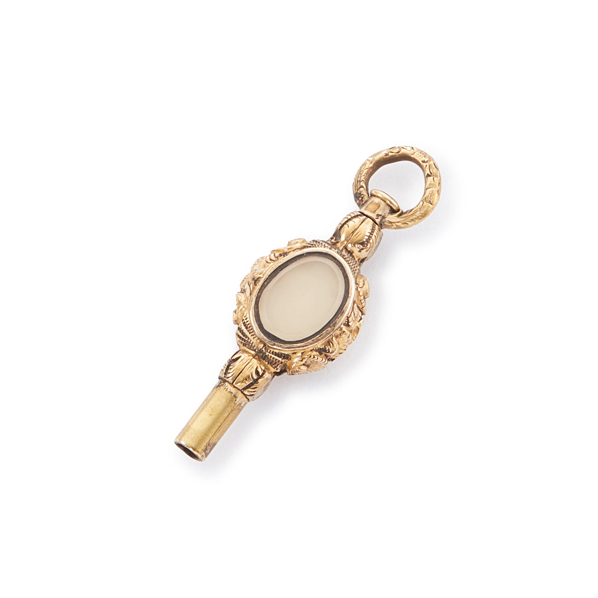 Quaint miniature Victorian gold-plated watch key set with an amethyst on one side and white agate on the other.