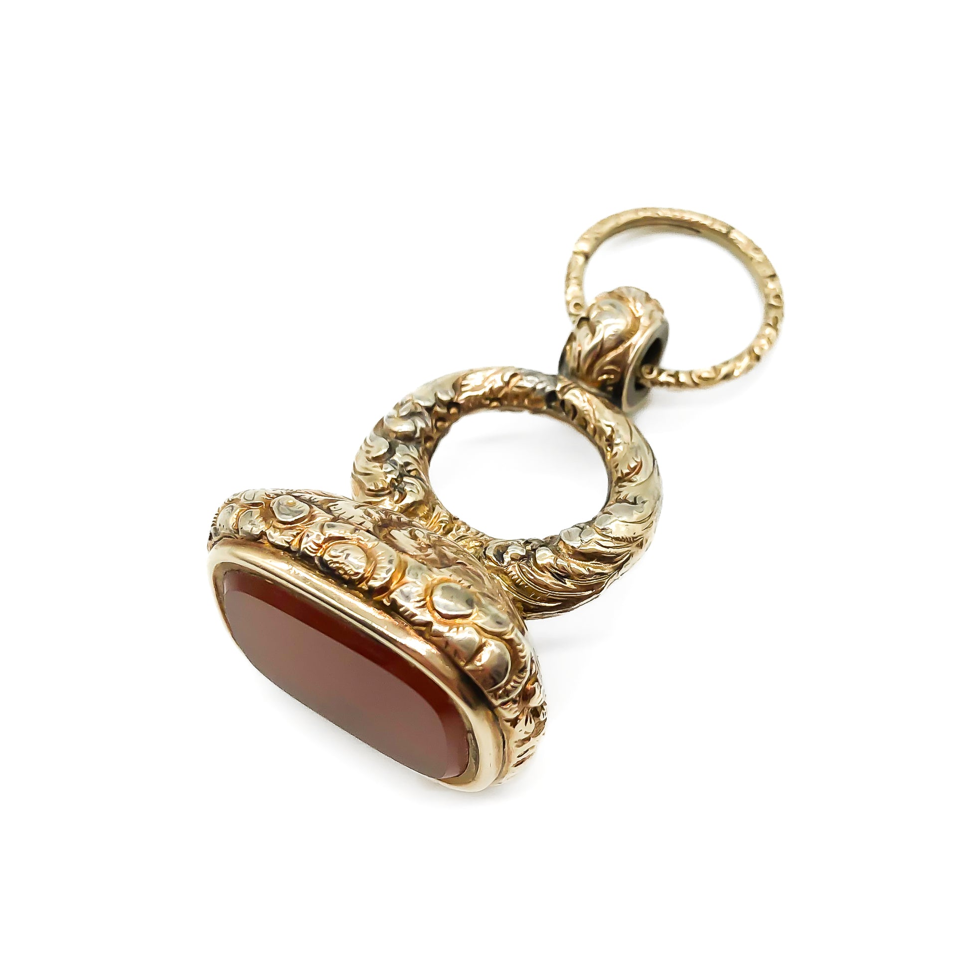 Large beautifully engraved gold cased Victorian seal set with a carnelian stone. Split ring attached.