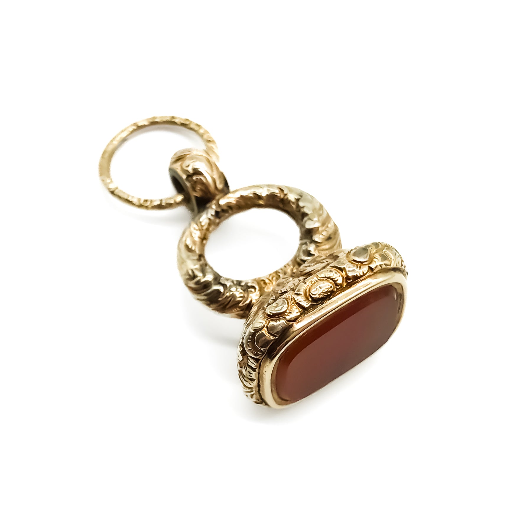 Large beautifully engraved gold cased Victorian seal set with a carnelian stone. Split ring attached.