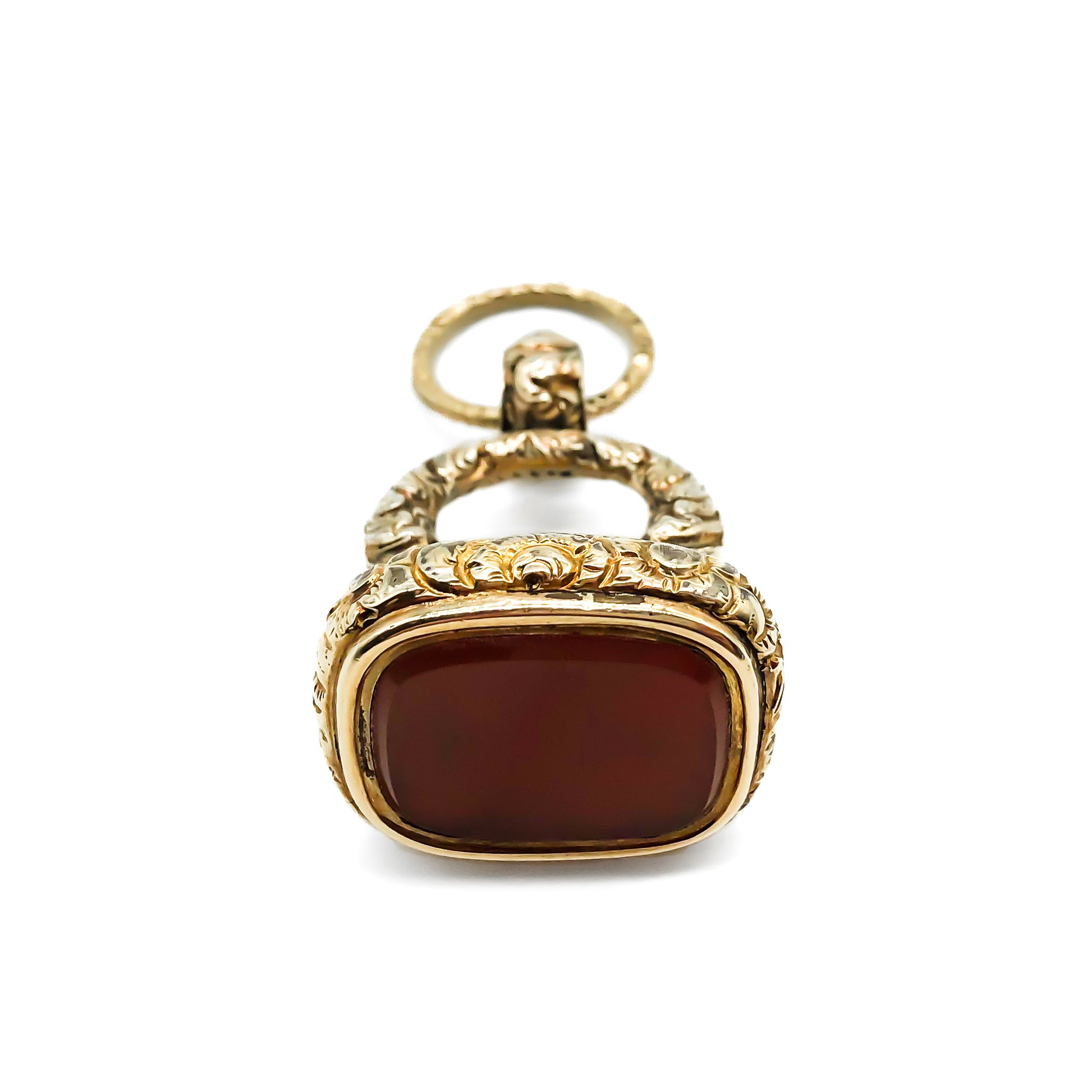 Large beautifully engraved gold cased Victorian seal set with a carnelian stone. Split ring attached.