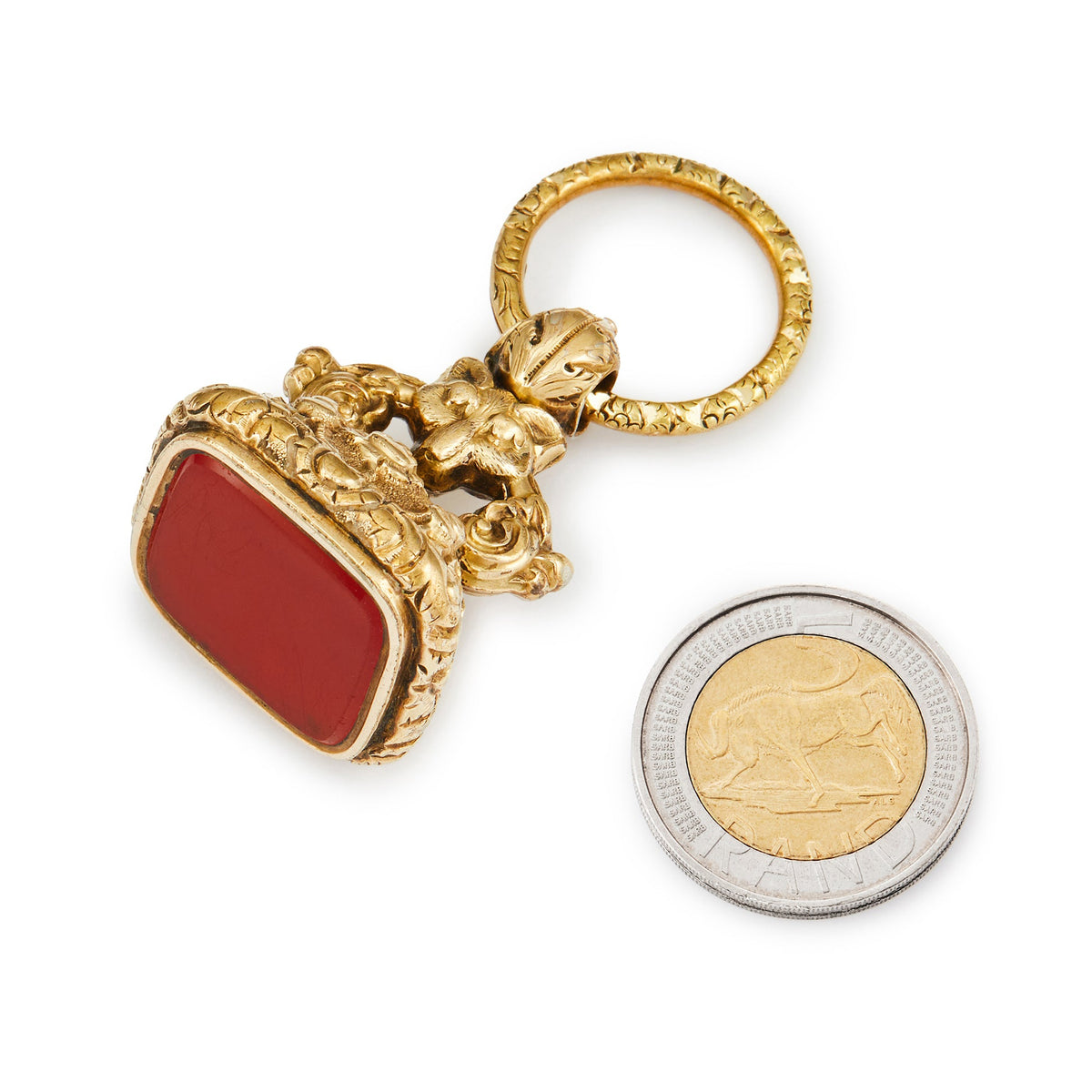 Gorgeous large Victorian gold plated fob seal with ornate detail, a repoussé wolf and a spilt-ring, set with a vibrant carnelian.
