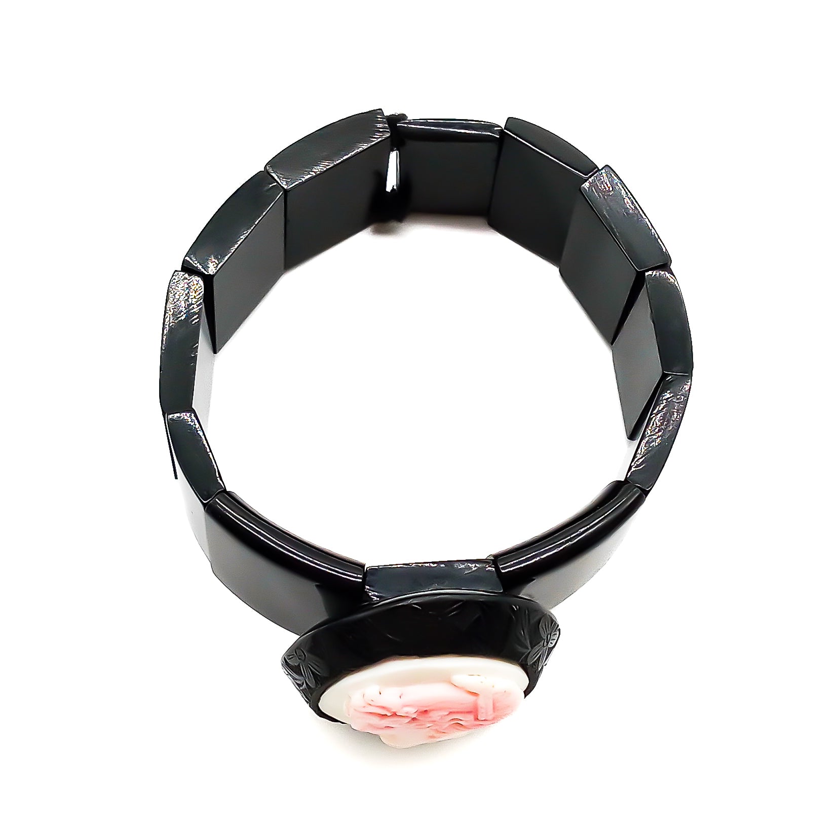 Victorian jet bracelet on elastic set with an unusual pink cameo in a beautifully carved oval jet frame.