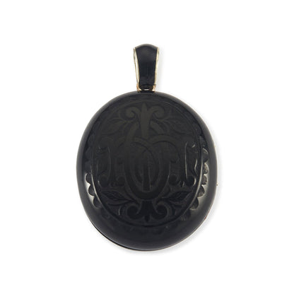 Exquisite Victorian jet monogrammed silver mourning locket which opens to a lock of hair behind glass, and space for a photograph. The bail has black enamelling.
