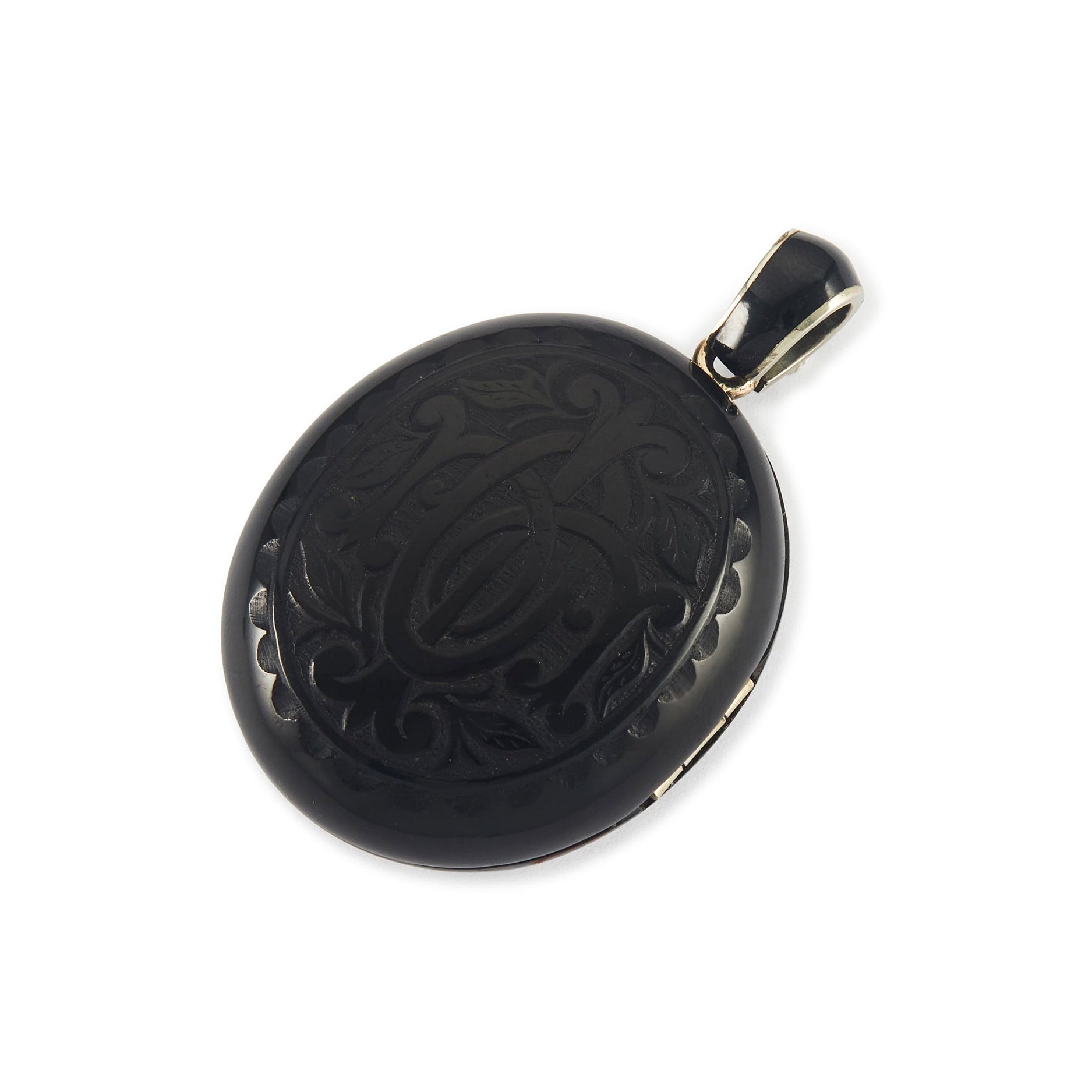 Exquisite Victorian jet monogrammed silver mourning locket which opens to a lock of hair behind glass, and space for a photograph. The bail has black enamelling.