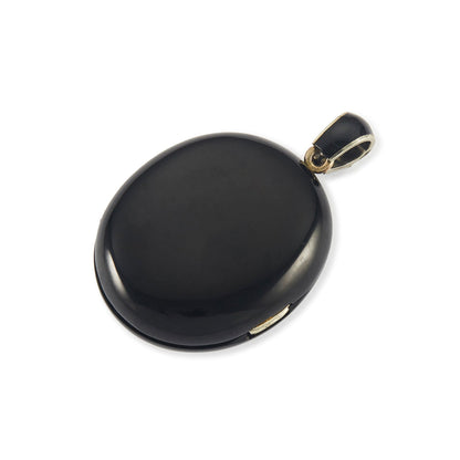 Exquisite Victorian jet monogrammed silver mourning locket which opens to a lock of hair behind glass, and space for a photograph. The bail has black enamelling.