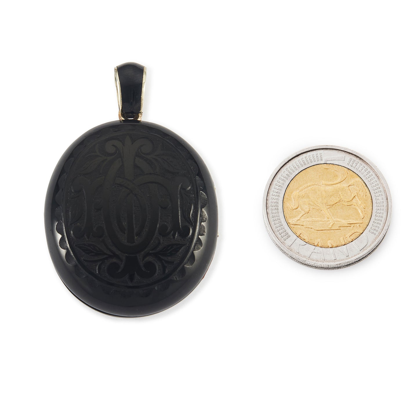 Exquisite Victorian jet monogrammed silver mourning locket which opens to a lock of hair behind glass, and space for a photograph. The bail has black enamelling.